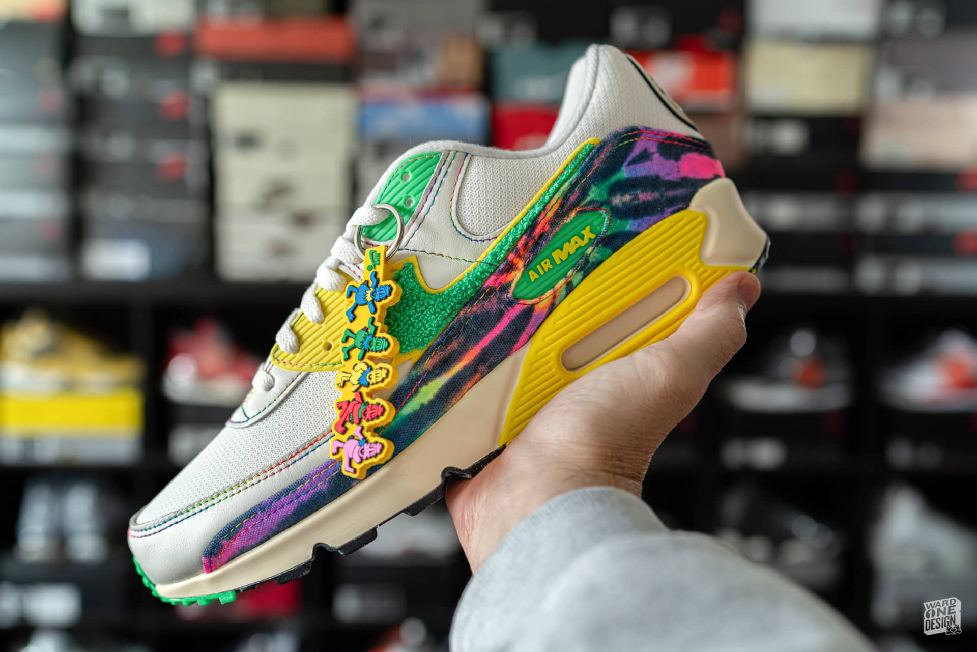 Close-up of Air Max 90 sneakers featuring colorful duck-themed design, vibrant patterns, and iconic branding, perfect for sneaker enthusiasts and collectors.