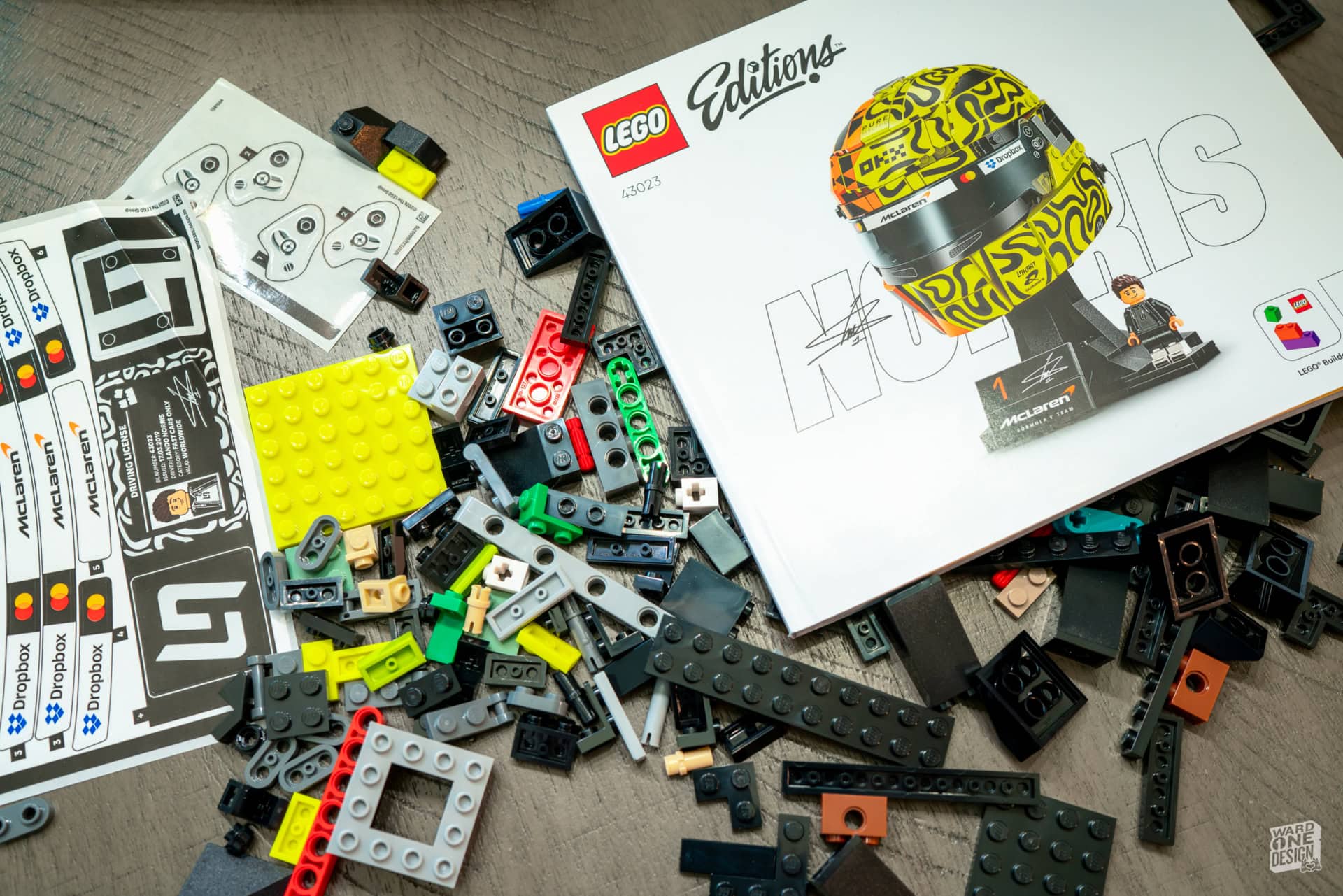 LEGO building set with various colorful bricks, instruction manual, and accessories for creative construction and play.