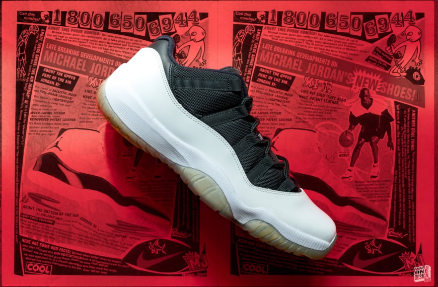Close-up of Air Jordan 11 Retro sneakers in white and black on red newspaper background, highlighting the shoe's design and materials.