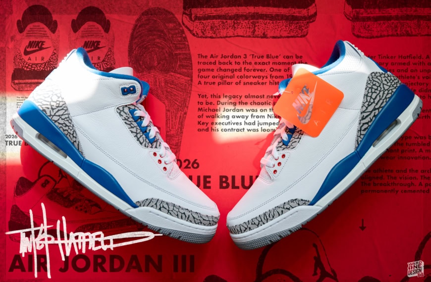 Close-up of Nike Air Jordan 3 Retro sneakers with white, blue, and gray design, displayed on red background with Nike branding and product tags.