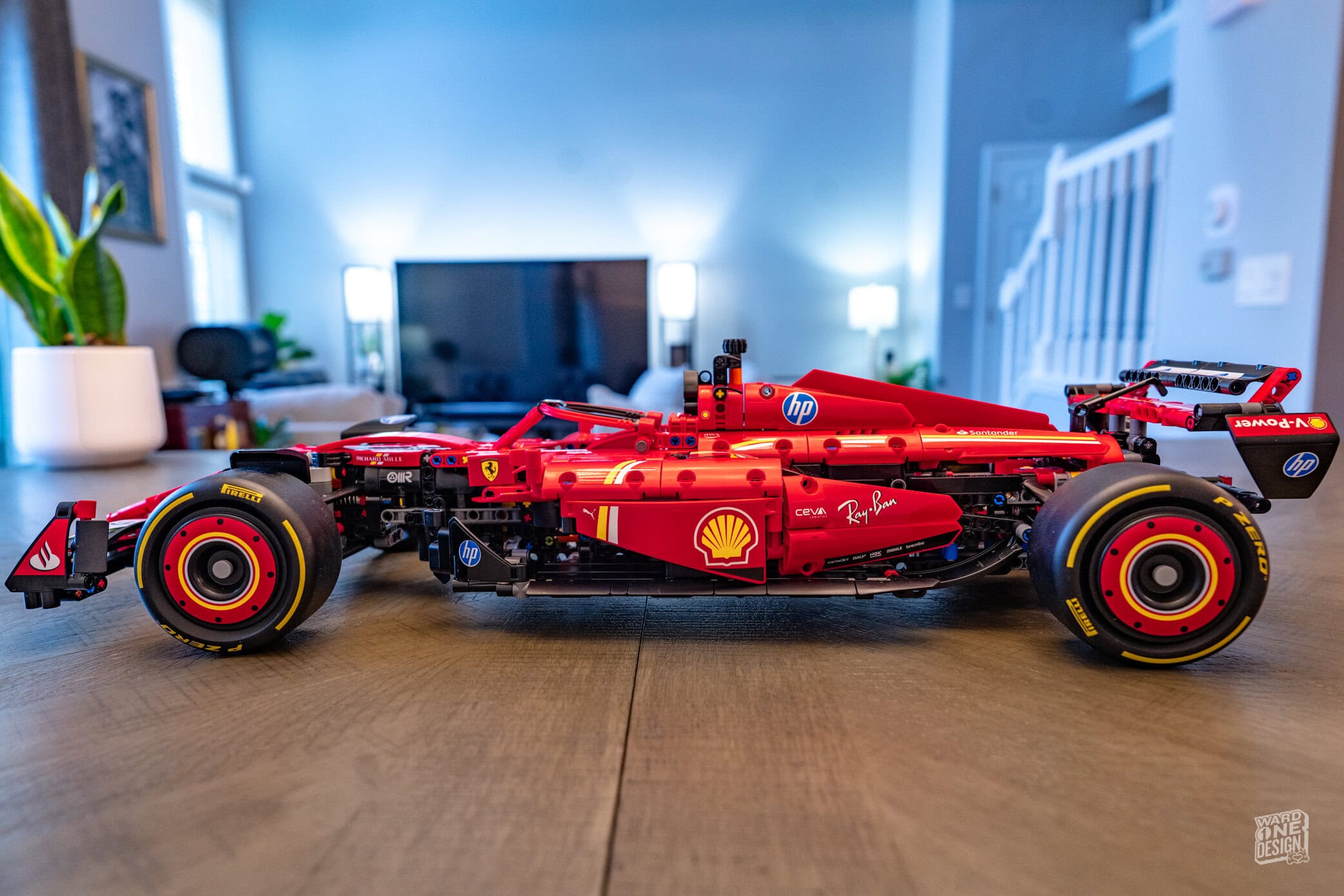 Lego model of the Ferrari SF-24 F1 race car, detailed and realistic, showcasing the iconic red design with sponsor logos like Shell and HP. Perfect for F1 fans and Lego enthusiasts.