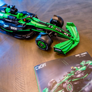 Kick Sauber F1 Team car model in green and black, showcasing detailed design and engineering. Perfect for F1 enthusiasts and collectors interested in Sauber's racing innovations.