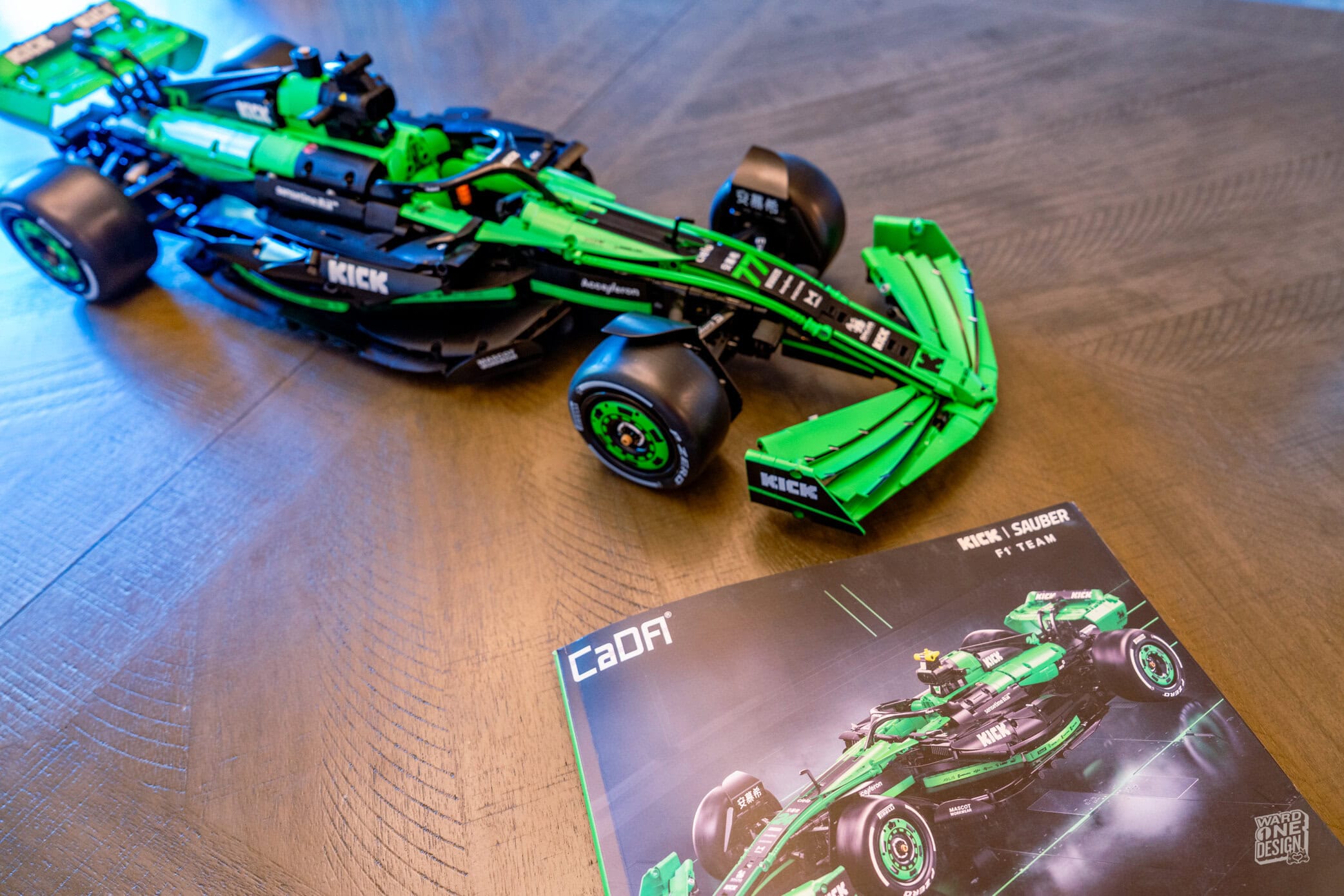Kick Sauber F1 Team car model in green and black, showcasing detailed design and engineering. Perfect for F1 enthusiasts and collectors interested in Sauber's racing innovations.