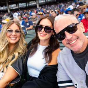 Fans enjoying the Sox vs Cubs Crosstown Series game at the stadium, showcasing excitement and team spirit among baseball enthusiasts.