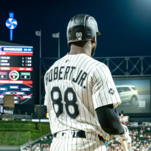 Chicago White Sox player Roberto with jersey number 88 at the game against Cleveland Guardians, standing on the field during a night game.