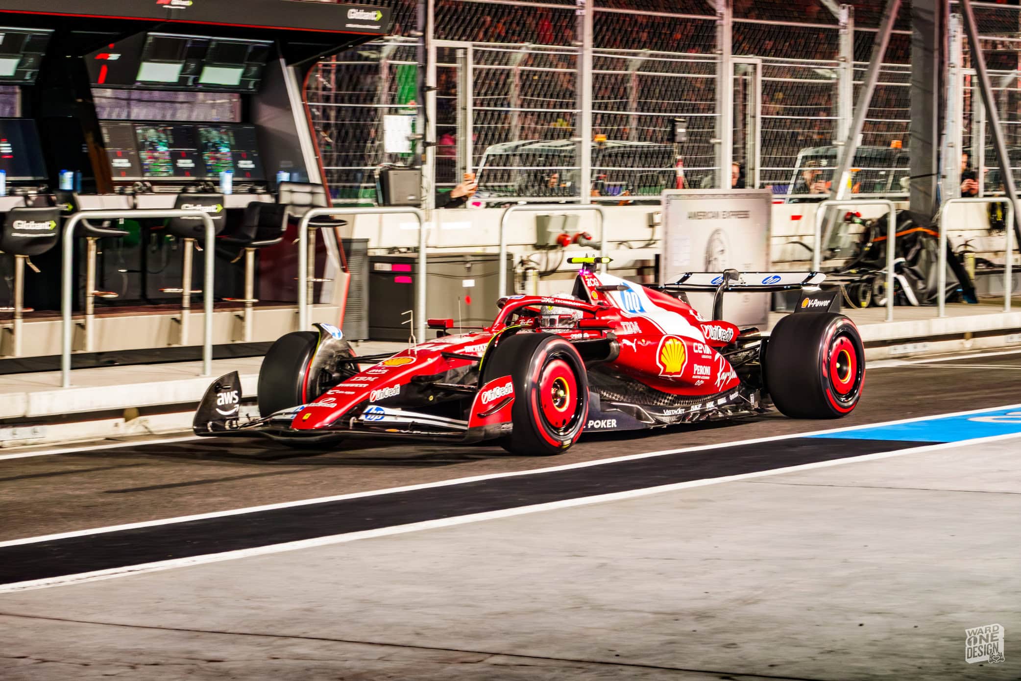 An F1 race car on the pit lane during the 2025 Las Vegas Grand Prix, showcasing high-speed racing technology and vibrant team colors.