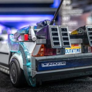 An intricately detailed Lego model of the DeLorean from Back to the Future, part of the Speed Champions series, showcasing the iconic time machine with futuristic design elements.