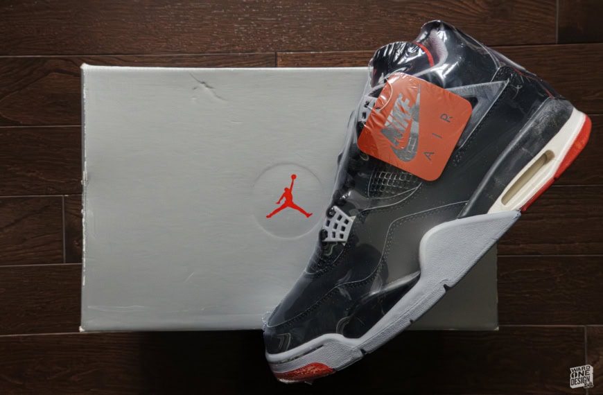 Air Jordan 4 Retro Bred sneaker with black, red, and white colorway, featuring iconic design and premium materials, perfect for sneaker enthusiasts and collectors.