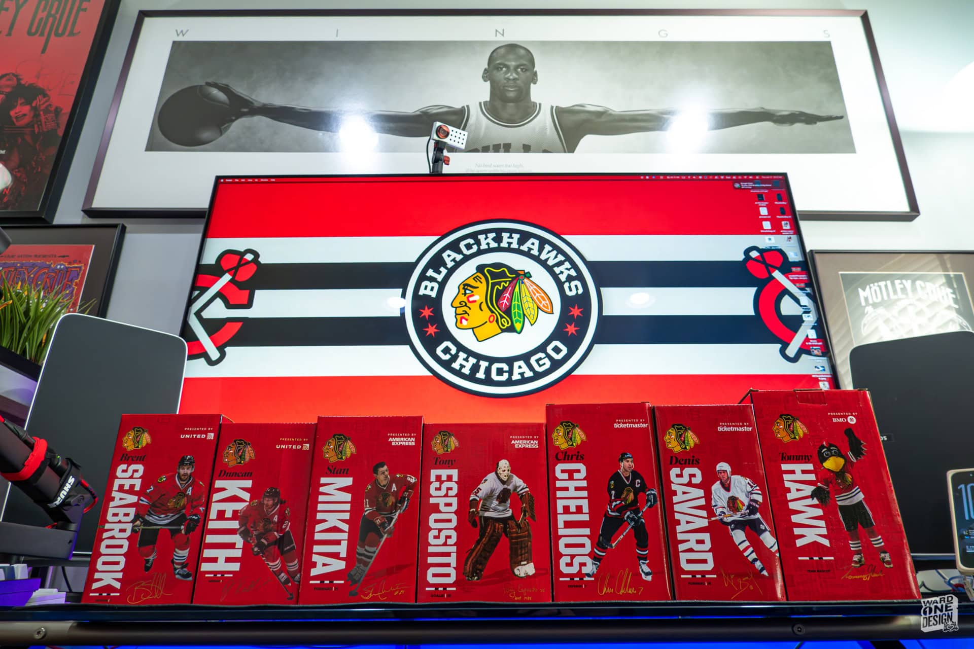 Chicago Blackhawks team logo and hockey player figurines on a retail shelf.
